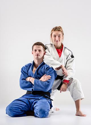 two-judokas-fighters-posing-wear-BRAZILIAN-JIU-JITSU-GI