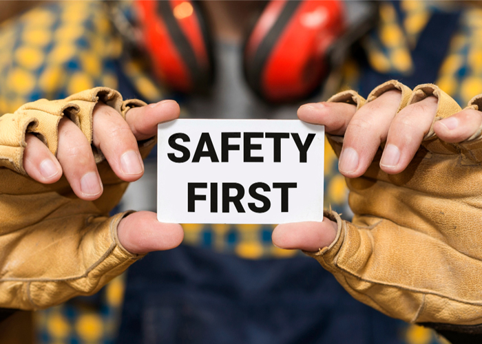 Image shown worker holding text Safety-First-at-Work
