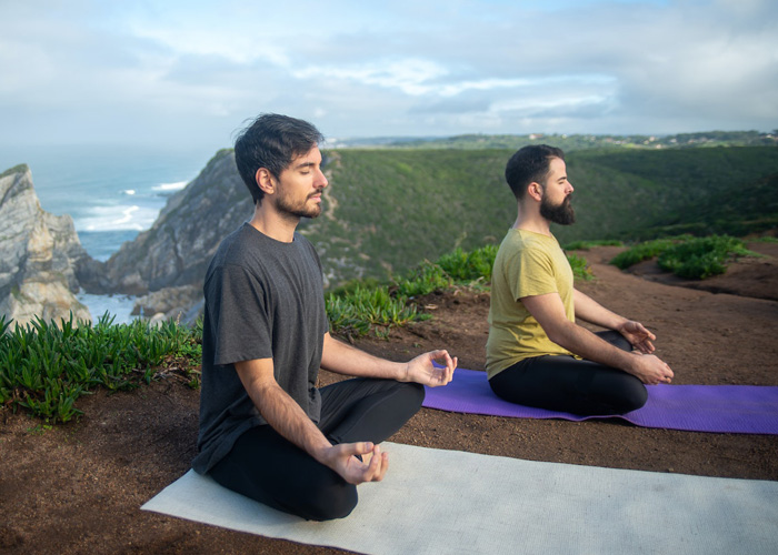 Image Shown two person do Yoga