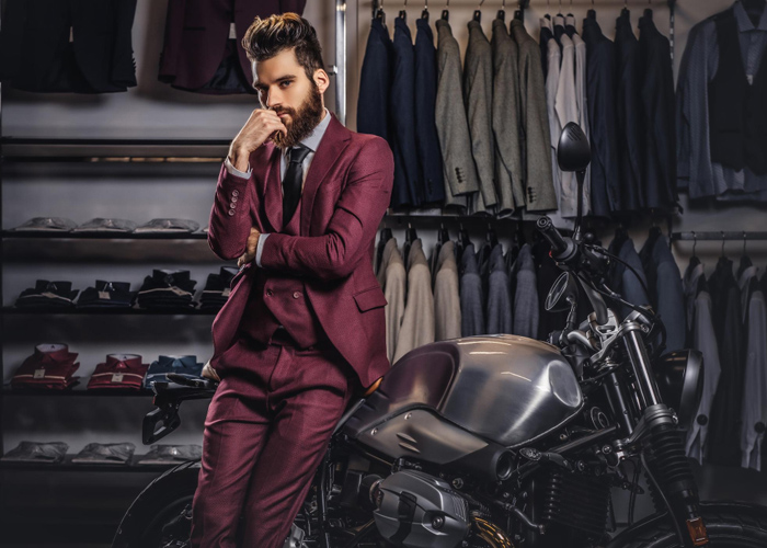 handsome-man-with-stylish-beard-hair-dressed-vintage-red-suit-posing-near-retro-sports-motorbike-men-s-clothing-store