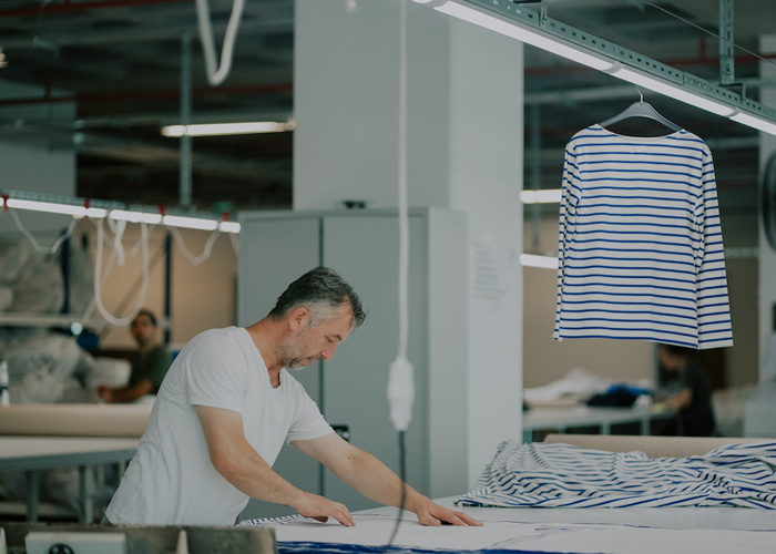 Man cut the fabric for garment production