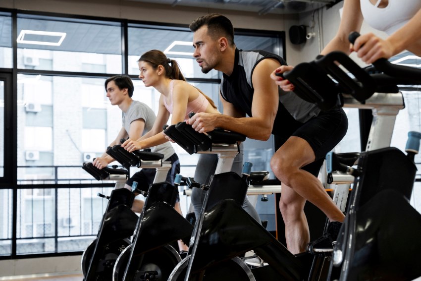people-doing-indoor-cycling-cardio-intensive- workout