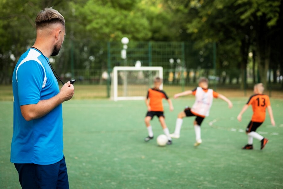 small-sided-games-football-trainer-teaching-his-pupils