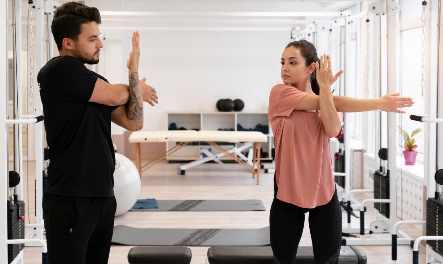 Medium shot physiotherapist helping patient